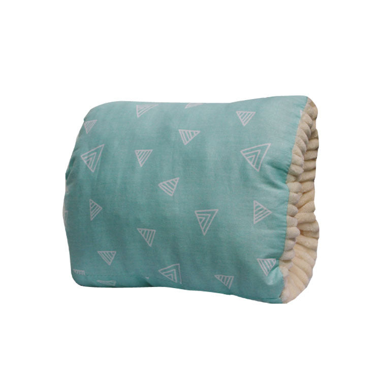Teal cotton baby nursing arm pillow with white triangle print and textured cream lining.