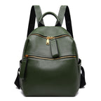 Small olive green top-grain leather backpack with two gold-zippered front pockets and black adjustable straps.