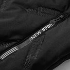 Close-up of a black winter jacket featuring a zippered pocket with "NEW SPORT" text and subtle geometric pattern.