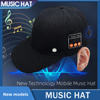 Black fabric baseball cap with built-in Bluetooth control panel on the side, featuring volume and play buttons.