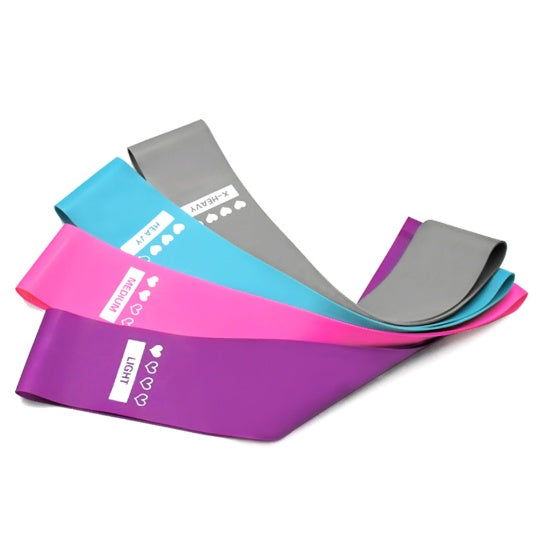 Four colorful, flat rubber resistance bands labeled light, medium, heavy, and x-heavy on a plain white background.