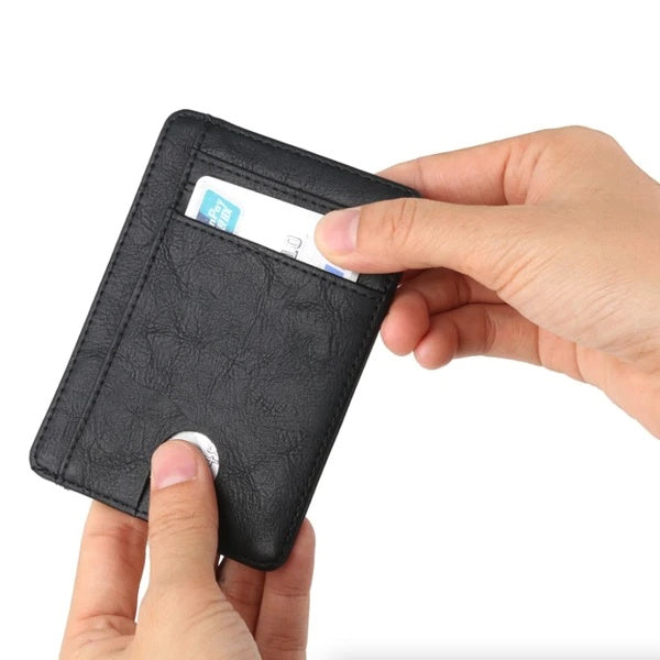 Hands holding a black textured PU leather slim RFID wallet with a visible credit card slot.