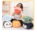 Woman holding a plush, red lobster hand warmer, surrounded by soft, colorful animal-shaped plush hand warmers.