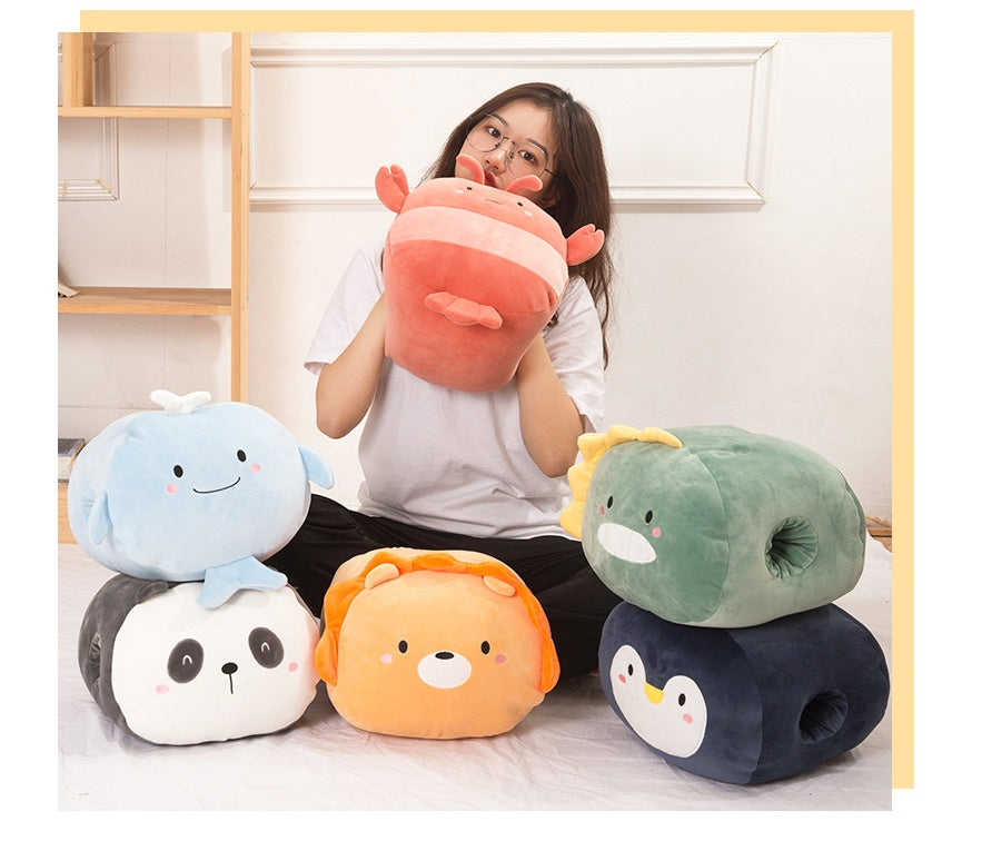 Woman holding a plush, red lobster hand warmer, surrounded by soft, colorful animal-shaped plush hand warmers.