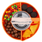 Orange silicone 4-compartment snack bowl for 40oz tumblers, filled with candy, cookies, and chips. Top-down view.
