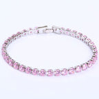 A silver-tone hip-hop tennis bracelet featuring a single row of round, sparkling pink zircon stones.