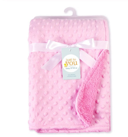 Soft pink baby blanket with textured raised dots, tied with a white satin ribbon and "Just to You" product tag.