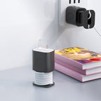 Black silicone protective case for Apple 18W/20W charger with integrated cable organizer, shown plugged and free-standing.