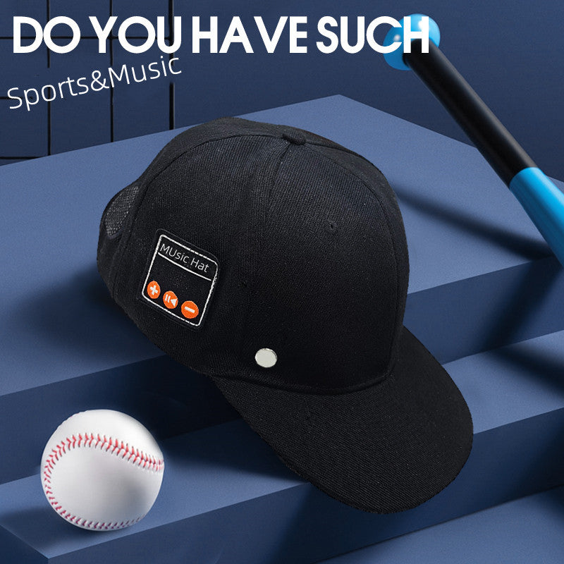 Black baseball cap with side music playback controls, mesh back, silver button, baseball, and bat on blue background.
