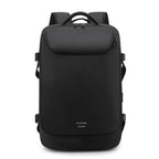 Black, sleek vacuum compression backpack with side buckles, top handle, and minimalist reflective accent.