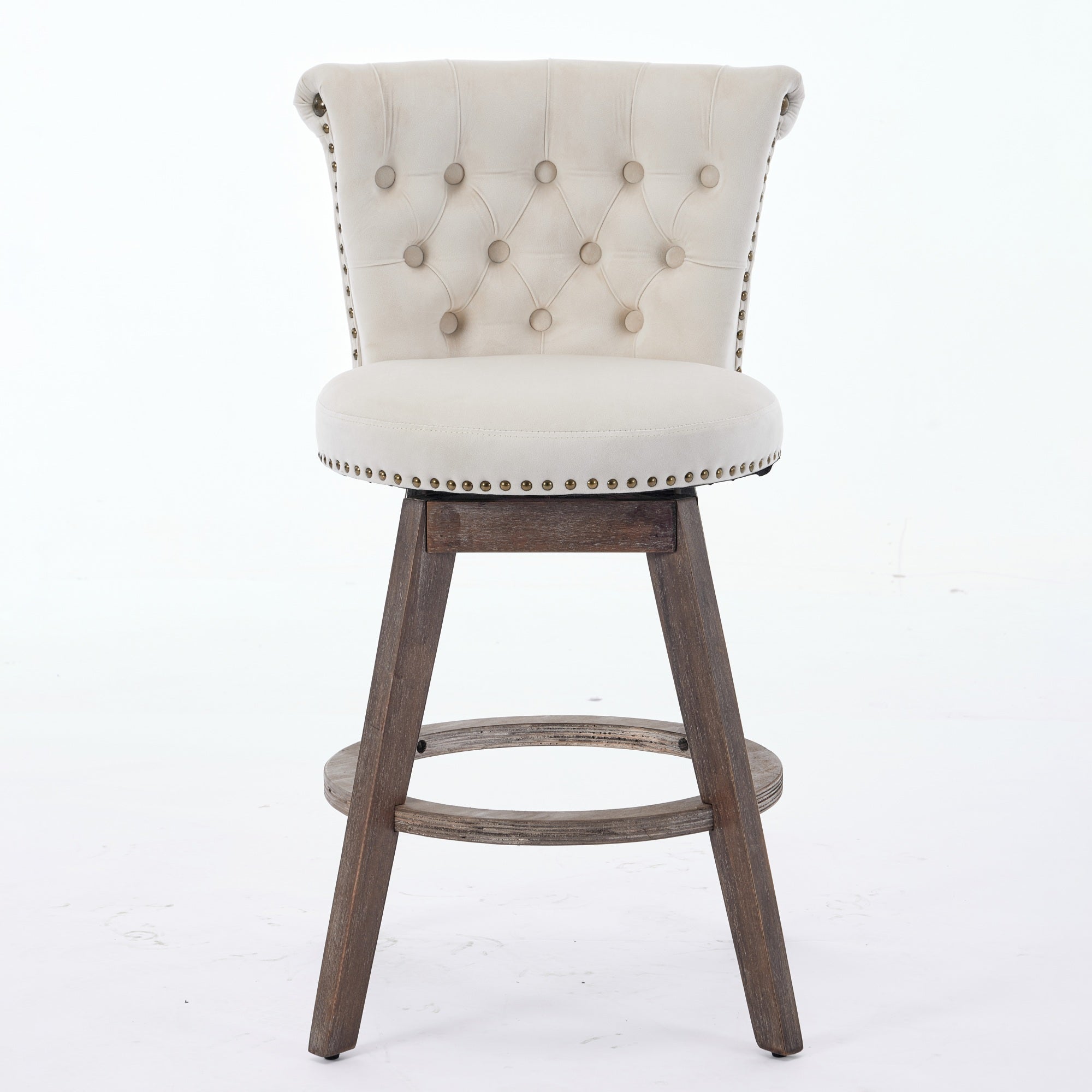 Beige tufted velvet swivel bar stool with nailhead trim and brown wooden legs on a white background.
