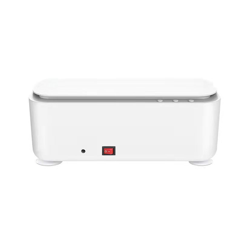 White rectangular ultrasonic cleaning machine for glasses with a red power switch on a minimalist plastic base.