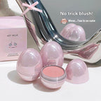 Art Value egg-shaped cosmetic blush in pearlescent light pink, featuring a matte powder compact and matching box.