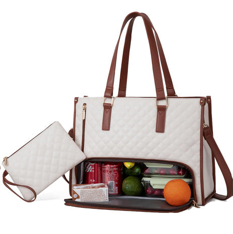 Quilted white lunch tote with brown trim and matching purse, featuring an insulated, zippered bottom compartment.