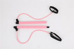 Pink chest expander puller with two foam-covered handles, resistance bands, and black foot/hand straps on white.