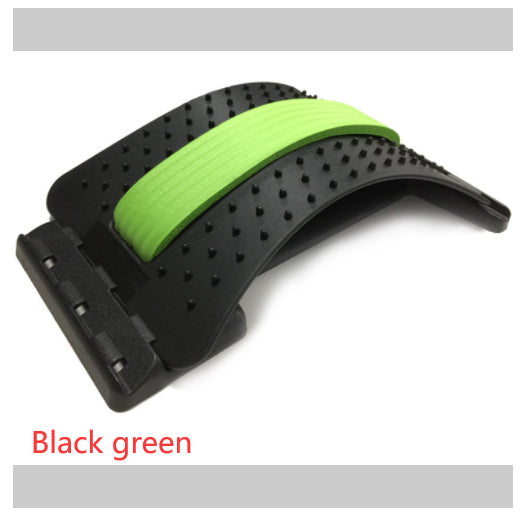 Black and green arched plastic lumbar stretcher with massage nubs and a central foam cushion for back pain relief.