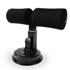 Black sit-up bar with foam-padded ankle supports and a circular suction cup base for floor mounting.