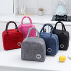 Five colorful, cationic fabric thermal lunch bags with zip-top closures, handles, and thermal insulation bag tags.