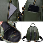 Green pebbled leather backpack with gold zippers, multiple pockets, and adjustable black straps.