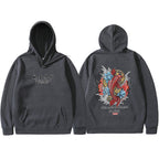 Dark charcoal hoodie featuring Ukiyoe-style red koi fish, blue lotus, and Japanese text on the back. Front has logo text.