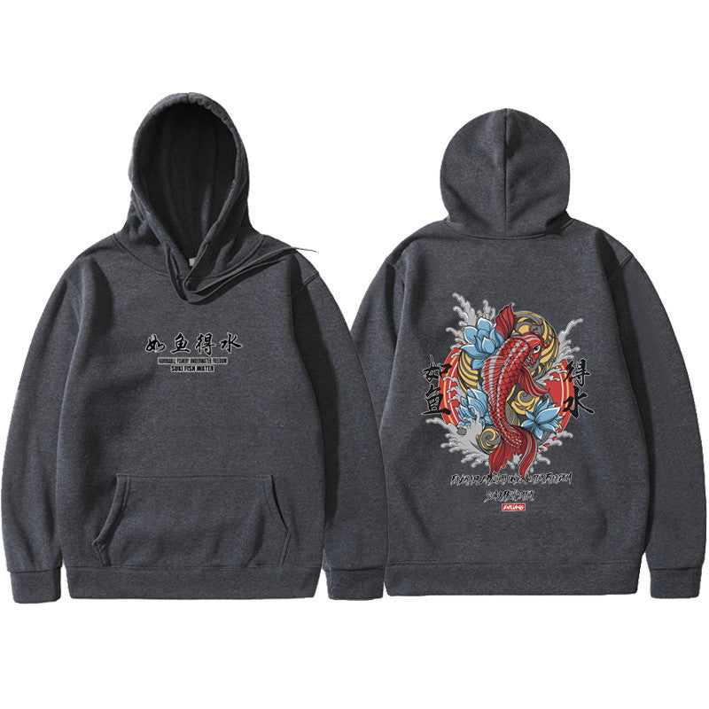 Dark charcoal hoodie featuring Ukiyoe-style red koi fish, blue lotus, and Japanese text on the back. Front has logo text.