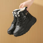Black windproof high-top boots with white fleece lining, lace-up front, and thick textured platform soles.