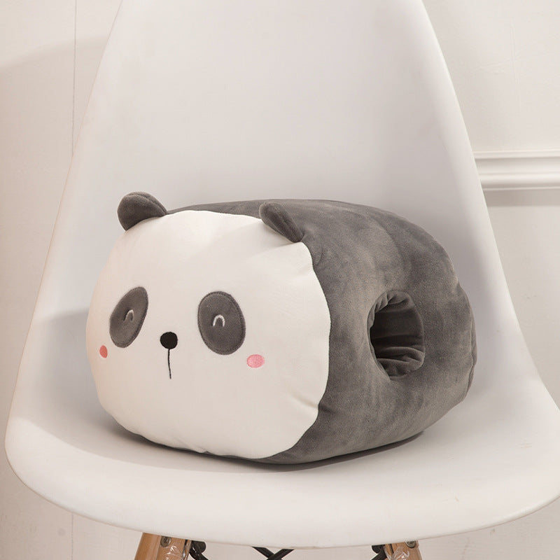 Plush panda hand warmer with a white face, gray body, and side openings, sitting on a white chair.