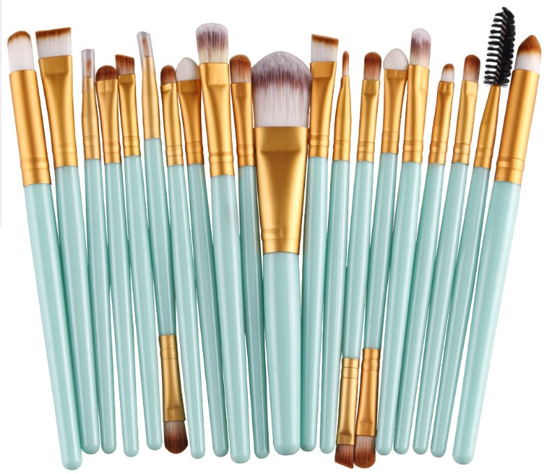 Digitaldistribution375 set: 20 makeup brushes with soft white-tipped bristles, gold ferrules, and light blue handles.
