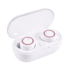 White in-ear wireless headphones with rose gold accents in an open, matching white plastic charging case.