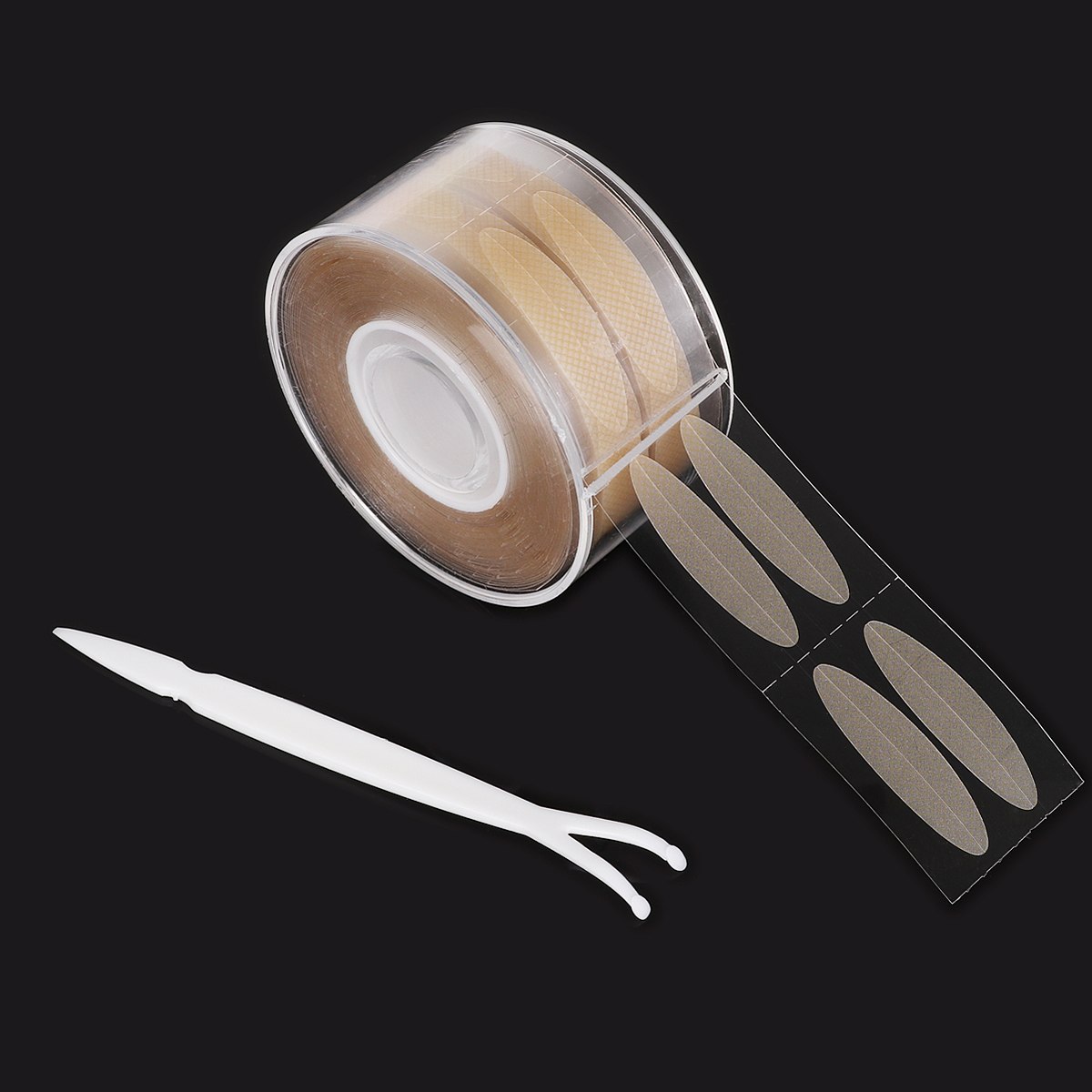 Roll of 600 beige, invisible adhesive double eyelid strips on a clear film with a white Y-shaped applicator tool.