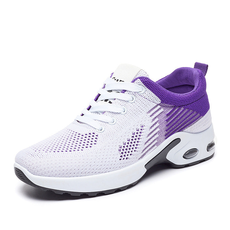 Women's white and purple knit running shoe with lace-up closure, breathable mesh, and cushioned air-sole heel.