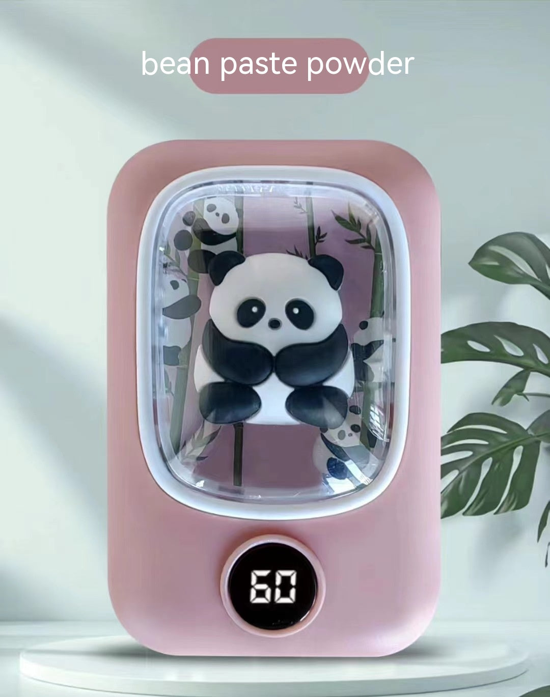 Pink, rechargeable panda-themed hand warmer with a clear display window, 3D panda figure, and digital temperature gauge.