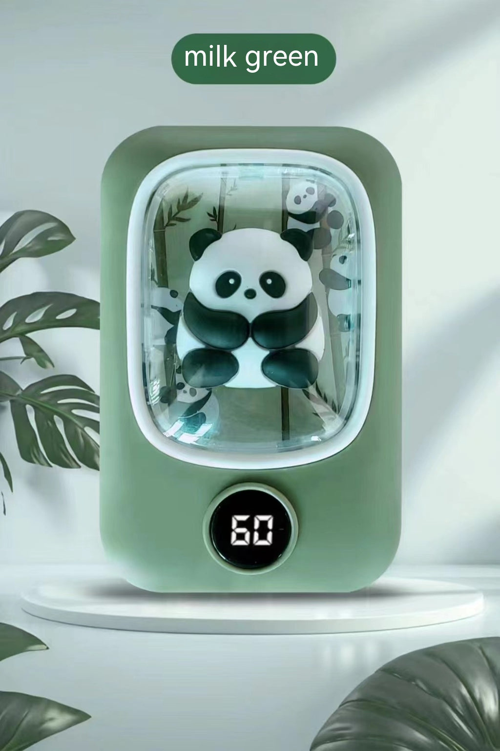 Milk green, rechargeable panda-themed hand warmer with digital temperature display and a clear viewing window.