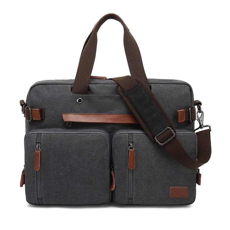 Dark gray canvas multifunctional messenger bag with brown faux leather trim, dual front pockets, and adjustable strap.