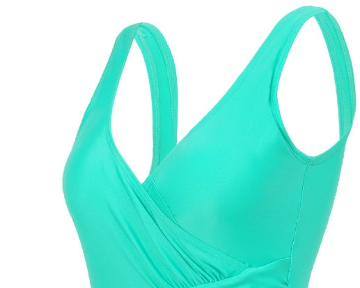 Bright turquoise women's swimsuit featuring a V-neckline with gathered, wrap-style fabric detailing.