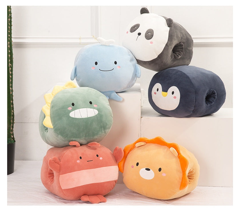 A collection of five plush, colorful animal-shaped hand warmers arranged on white blocks.