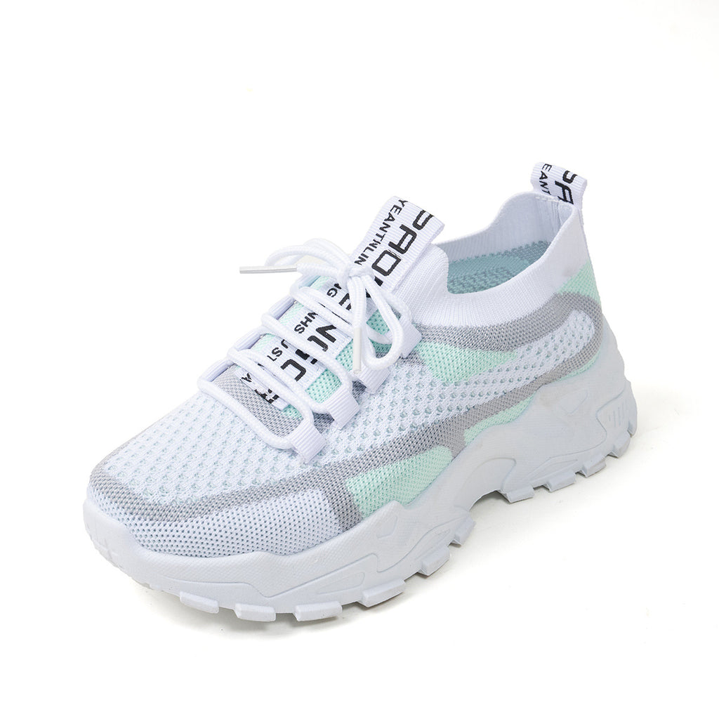 White lace-up sneakers in breathable mesh with light green and grey accents on a chunky white rubber sole.