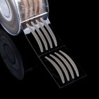 Roll of 600 beige, mesh-textured, adhesive double eyelid strips on a clear plastic backing against a black background.