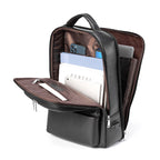 Black leather multifunctional backpack with USB port, opened to show brown interior, laptop sleeve, and storage pockets.