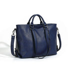 Large blue soft leather tote bag with top handles, silver hardware, and a detachable shoulder strap.