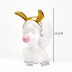 White girl bust vase with gold bunny ears, blowing a pink bubble, and measurement markings. Size: 19.3cm x 14.5cm.