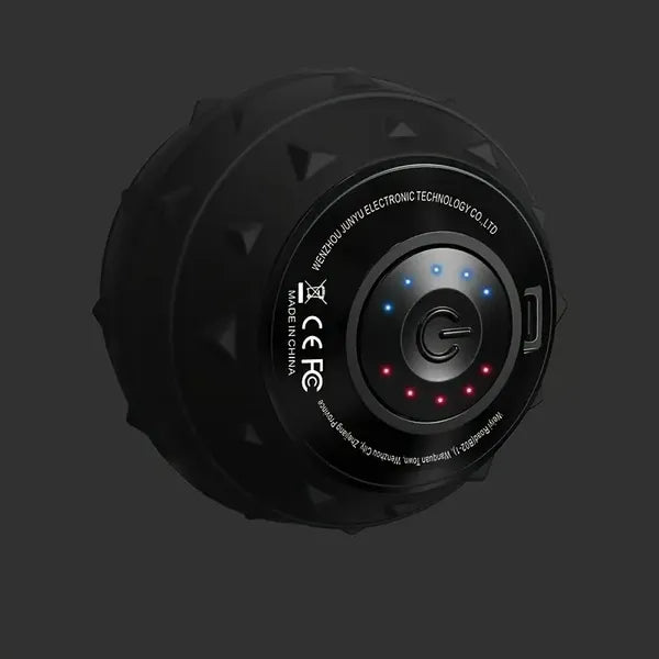 Black, textured vibration massage ball with a central power button, LED indicators, and USB port for muscle recovery.