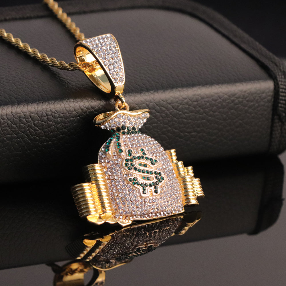 Gold-tone hip-hop pendant featuring a rhinestone-encrusted money bag with a green dollar sign on a rope chain.