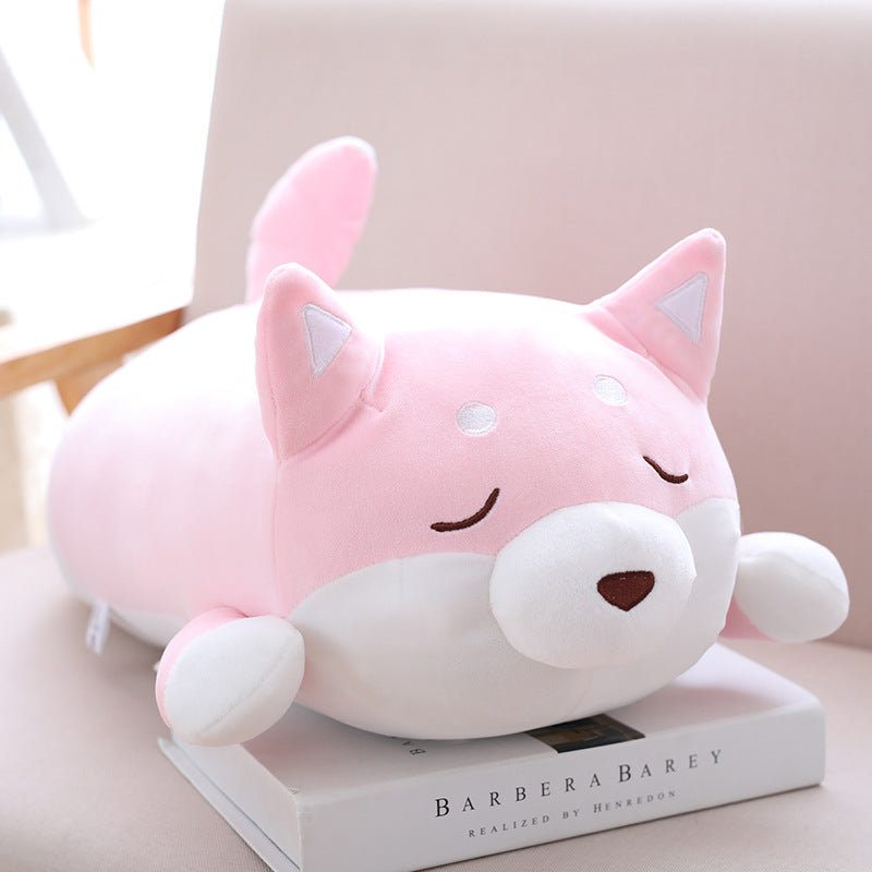 Cute pink and white Shiba Inu plush pillow with a soft, rounded body, closed eyes, and small, upright ears.