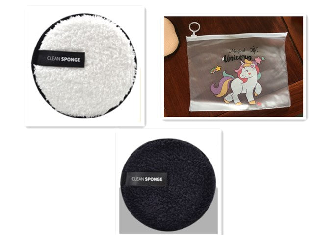 White and black round plush makeup removal puffs with "Clean Sponge" labels, plus a clear unicorn storage pouch.