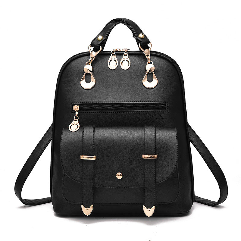 Black PU leather dual-use backpack featuring gold-tone hardware, a front flap pocket, and top carry handles.