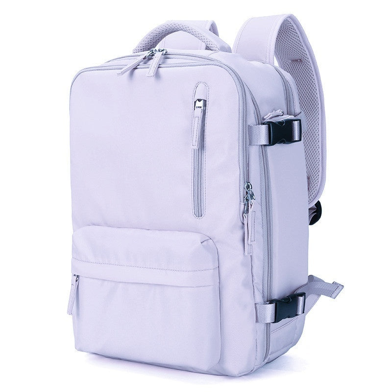 Light purple waterproof travel backpack with multiple zippered pockets, side compression straps, and padded mesh straps.