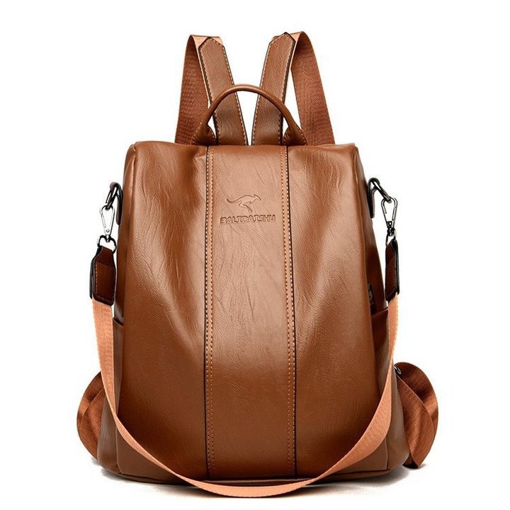 Large capacity brown soft leather women’s travel backpack with adjustable straps and embossed kangaroo logo.