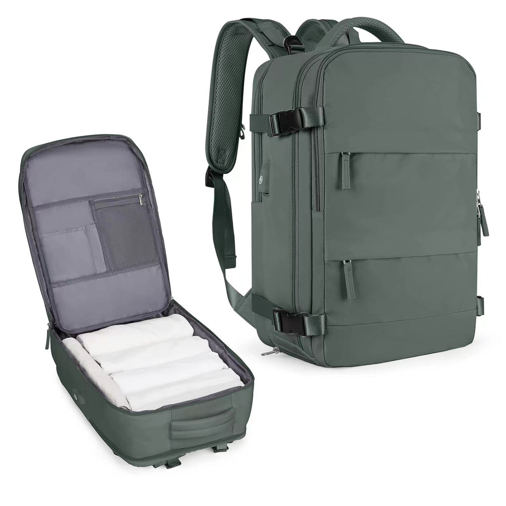 Sage green waterproof travel backpack with side compression straps, internal organizers, and padded shoulder straps.