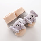 Grey and peach baby socks with plush 3D elephant appliques. Soft cotton-blend fabric, ribbed cuffs.